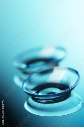 Photo: contact lens on blue background contact lens on blue background