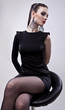 Gorgeous young woman sitting on a chair