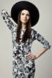 Romantic Beauty in black hat. Retro Style photo.