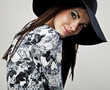 Romantic Beauty in black hat. Retro Style photo.
