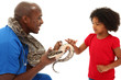 Black Male Vet Holding Snake With Young Child