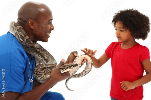 Photo: Black Male Vet Holding Snake With Young Child Black Male Vet Holding Snake With Young Child