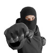 Foto: Masked criminal with clenched fist, isolated on white Masked criminal with clenched fist, isolated on white