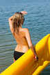 Details der Fotografie Summer woman by sea water floating mattress