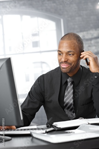 Photo: Businessman multitasking Businessman multitasking