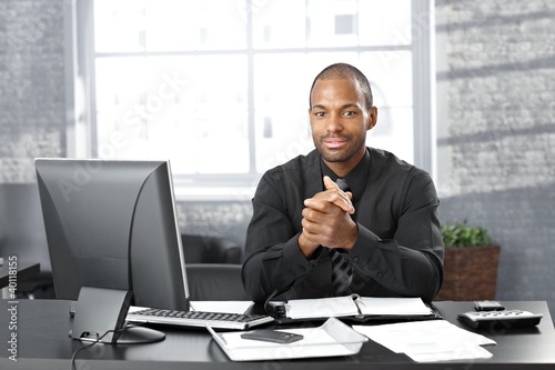 Photo: Businessman at office desk Businessman at office desk
