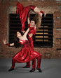 Dancers in action against brick wall Dancers in action against brick wall