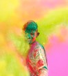 Holi celebrations in India. Closeup of a boy playing Holi