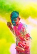 Holi celebrations in India. Young boy with water balloons