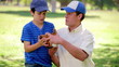Little boy wearing a baseball glove