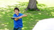 Smiling child playing baseball with his father