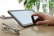 Finger touching screen of a digital tablet