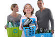 Girl and parents recycling