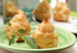 fresh creamy eclair cakes served on green plate