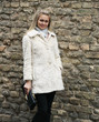 Young Pretty Woman In Fur Coat With Clutch Young Pretty Woman In Fur Coat With Clutch