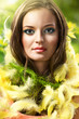 Photo: easter picture of young woman with feathers green background easter picture of young woman with feathers green background