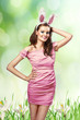 Photo: easter picture of young woman with feathers green background easter picture of young woman with feathers green background