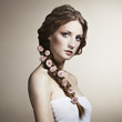 Portrait of a beautiful woman with flowers in her hair