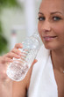 Woman drinking water after sport