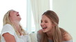 Laughing friends talking to each other
