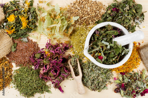 Photo: healing herbs on wooden table, herbal medicine healing herbs on wooden table, herbal medicine