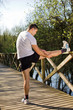 Young man stretching at the park Young man stretching at the park