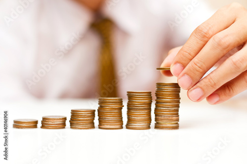 Photo: a man rising coins a man rising coins