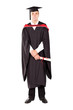 young male graduate in cap and gown full length