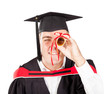 funny male graduate looking through certificate