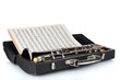 Antique clarinet in case and notebook with notes isolated Antique clarinet in case and notebook with notes isolated