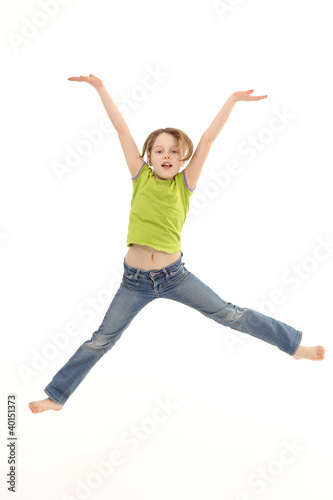 Photo: Girl jumping isolated on white background Girl jumping isolated on white background