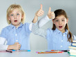 Two surprised girlfriends learning together at school