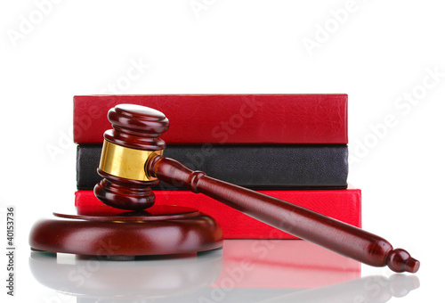 Photo: Judge's gavel and books isolated on white Judge's gavel and books isolated on white