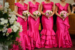 Row of bridesmaids with flowers