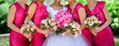 Row of bridesmaids with flowers