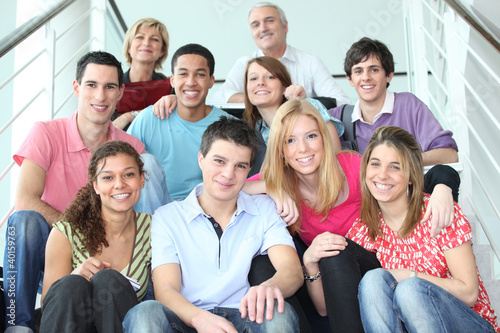 Photo: Group of young people sitting on stairs Group of young people sitting on stairs