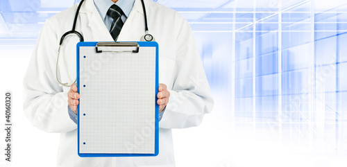 Photo: doctor holding graph paper doctor holding graph paper