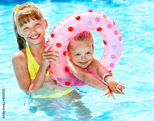 Photo: Child sitting on inflatable ring. Child sitting on inflatable ring.