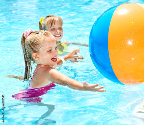 Photo: Children swimming in pool. Children swimming in pool.