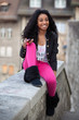 Portrait of a happy young african american teenage girl listenin