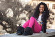 Portrait of a happy young african american teenage girl listenin