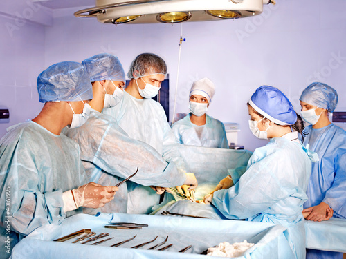 Photo: Woman on gurney in operating room. Woman on gurney in operating room.