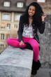 Portrait of a happy young african american teenage girl listenin