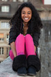 Portrait of a happy young african american teenage girl listenin