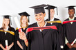 happy female indian graduate with classmates at graduation