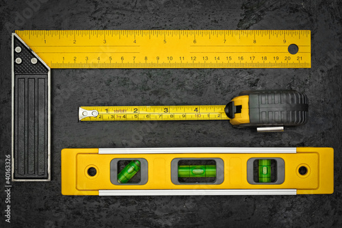 Photo: Measuring tools on a black metallic background Measuring tools on a black metallic background
