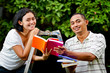ethnic young couple study books together ethnic young couple study books together