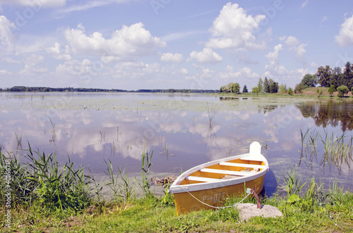 Photo: Yellow boat moored shore. Amazing landscape Yellow boat moored shore. Amazing landscape