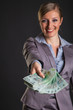 Photo: Woman with polish zloty money on dark gray background Woman with polish zloty money on dark gray background