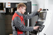 Photo: laborer working with machine tool laborer working with machine tool